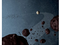 asteroids-that-lap-the-sun-in-the-same-orbit-as-Jupiter-are-uniformly-dark-with-a-hint-of-burgundy-color.jpg